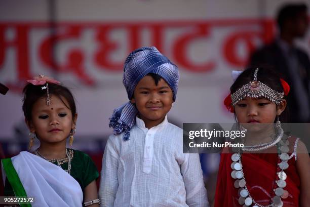 Portrait of Nepalese Tharu community kids in a traditional attire during prade of the Maghi festival celebrations or the New Year of the Tharu...