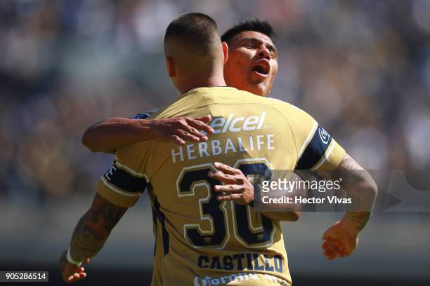 Nicolas Castillo of Pumas celebrates with teammate after scoring the third goal of his team during the second round match between Pumas UNAM and...