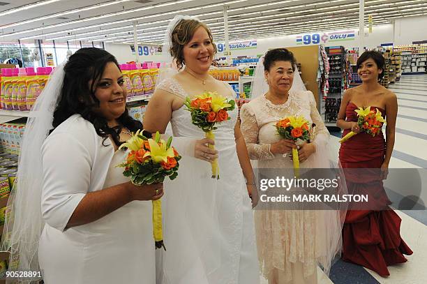 Brides wait for their 99 cent wedding ceremony at the 99 cent store in Los Angeles on September 9, 2009. The budget supermarket chain helped nine...