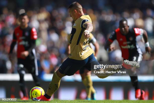 Nicolas Castillo of Pumas kicks the penalty to score the third goal of his team during the second round match between Pumas UNAM and Atlas as part of...