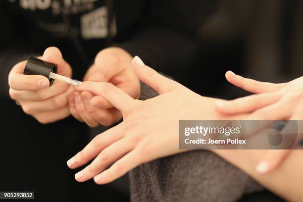 Model gets prepared ahead of the Dawid Tomaszewski show during the MBFW January 2018 at ewerk on January 15, 2018 in Berlin, Germany.