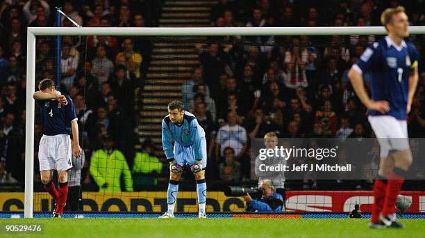 Stephen McManus, David Marshall and Darren Fletcher of Scotland react after conceding a goal to the Netherlands during the FIFA 2010 World Cup Group...