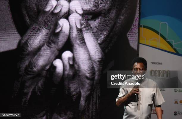 Edson Arantes do Nascimento, known in the World by the nickname of Pele, uses a walker to stand on stage, during the opening event of the 2018...