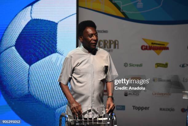 Edson Arantes do Nascimento, known in the World by the nickname of Pele, uses a walker to stand on stage, during the opening event of the 2018...