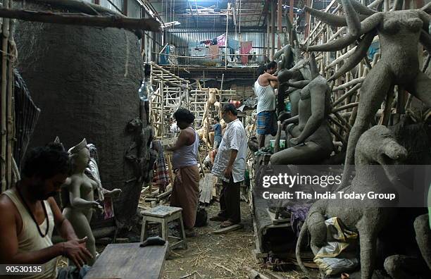 Artists making Durga idols in Kumartuli, Kolkata, West Bengal, India