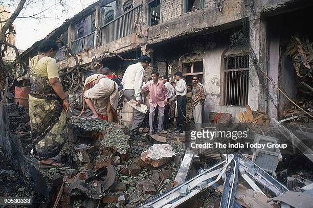 Onlookers at a bomb blast site in Mumbai