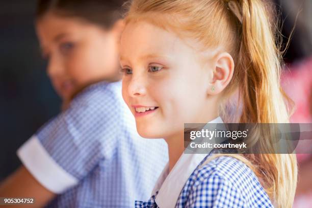 schoolgirl in uniform. - first day of school australia stock pictures, royalty-free photos & images