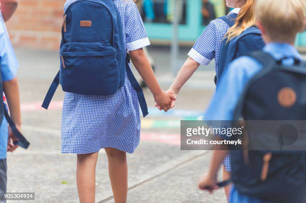 School children walking away.