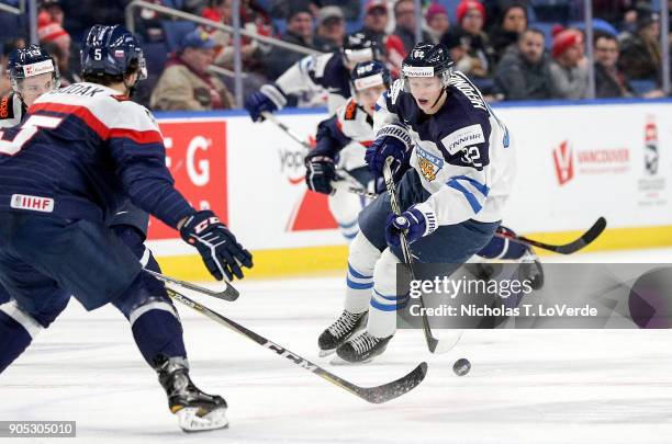 Aleksi Heponiemi of Finland skates the puck up ice against Slovakia during the second period of play in the IIHF World Junior Championships at the...