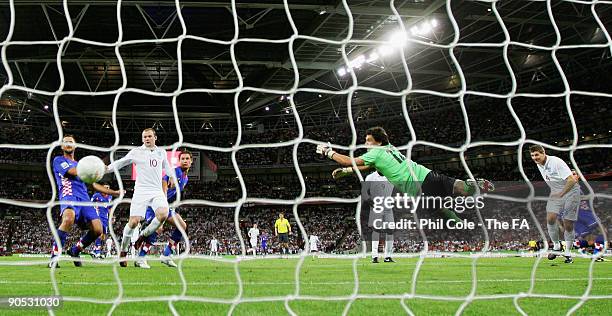 Steven Gerrard of England heads past Vedran Runje to score his team's second goal of Croatia during the FIFA 2010 World Cup Qualifying Group 6 match...