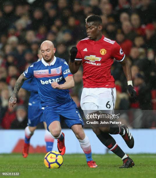 Paul Pogba of Manchester United in action with Stephen Ireland of Stoke City during the Premier League match between Manchester United and Stoke City...
