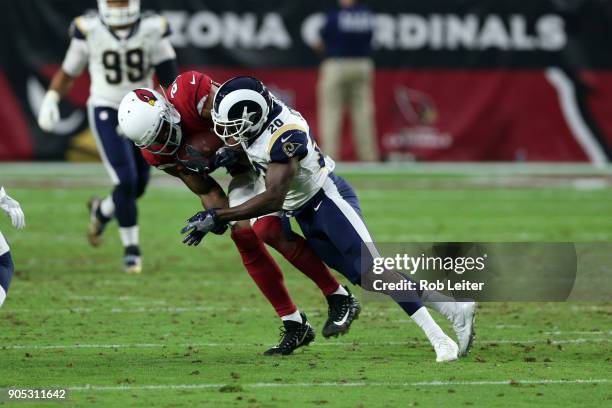 Lamarcus Joyner of the Los Angeles Rams tackles Rickey Seals-Jones during the game against the Arizona Cardinals at University of Phoenix Stadium on...