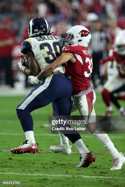 Tyrann Mathieu of the Arizona Cardinals tackles Todd Gurley II during the game against the Los Angeles Rams at University of Phoenix Stadium on...