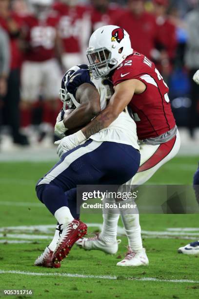 Tyrann Mathieu of the Arizona Cardinals tackles Todd Gurley II during the game against the Los Angeles Rams at University of Phoenix Stadium on...