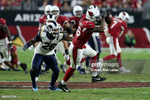 Ricky Seals-Jones of the Arizona Cardinals makes the catch as Mark Barron defends during the game against the Los Angeles Rams at University of...