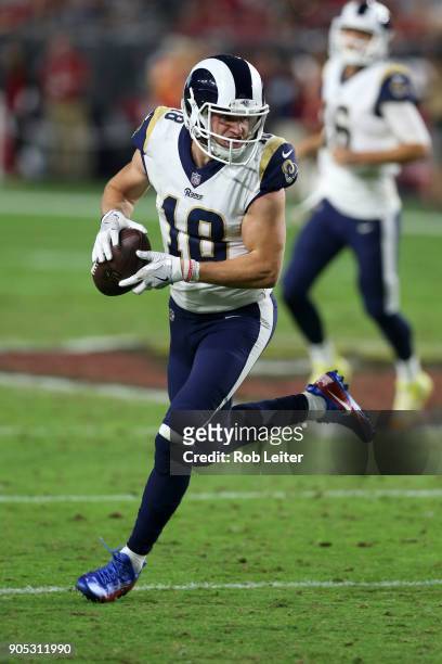 Cooper Kupp of the Los Angeles Rams runs after the catch during the game against the Arizona Cardinals at University of Phoenix Stadium on December...