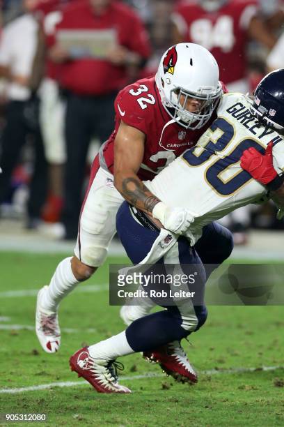 Tyrann Mathieu of the Arizona Cardinals tackles Todd Gurley II during the game against the Los Angeles Rams at University of Phoenix Stadium on...
