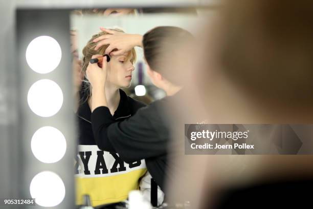 Model gets prepared ahead of the Dawid Tomaszewski show during the MBFW January 2018 at ewerk on January 15, 2018 in Berlin, Germany.