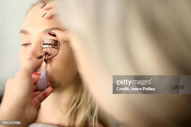 Model gets prepared ahead of the Dawid Tomaszewski show during the MBFW January 2018 at ewerk on January 15, 2018 in Berlin, Germany.