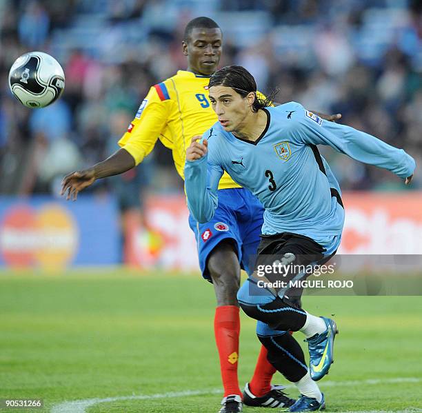 Uruguay's defender Martin Caceres vies for the ball with Colombia's midefielder Gustavo Adrian Ramos during their FIFA World Cup South Africa 2010...