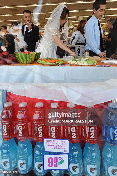 Bonnie Cam and Jon Nguyen enjoy a banquet after their 99 cent wedding ceremony at the 99 cent store in Los Angeles on September 9, 2009. The budget...