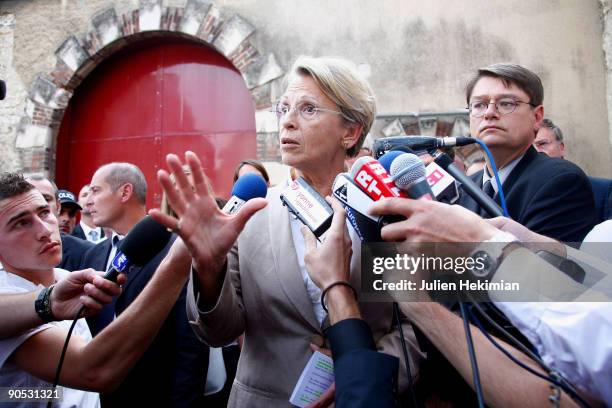 French minister for Justice Michele Alliot-Marie speaks to the media as she leaves Auxerre's prison one day after Jean-Pierre Treiber escaped on...