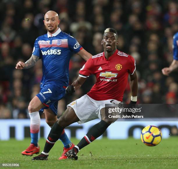 Paul Pogba of Manchester United in action with Stephen Ireland of Stoke City during the Premier League match between Manchester United and Stoke City...