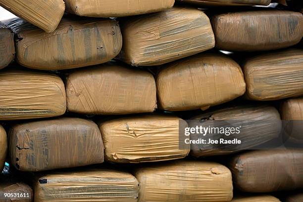 Bricks of confiscated marijuana are stacked September 9, 2009 in Miami Beach, Florida. While on routine law enforcement patrol in the Florida...