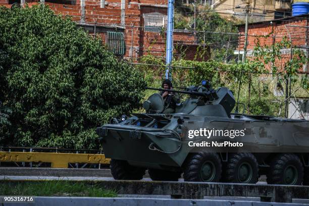 An armoured tank from the Venezuelan army drives along a highway in Caracas as an operation to capture Oscar Perez, a rebel against the government of...