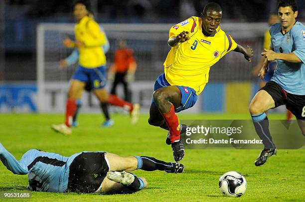 Colombia's Adrian Ramos vies for the ball with Bruno Silva of Uruguay during their 2010 FIFA World Cup qualifier at the Centenario Stadium on...