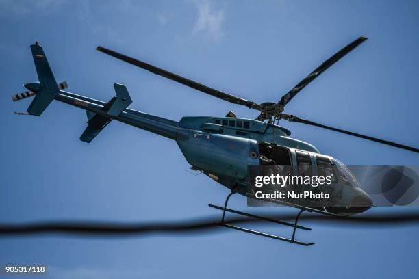 Helicopter of the Venezuelan police is seen in Caracas as an operation to capture Oscar Perez, a rebel against the government of Nicolas Maduro, died...