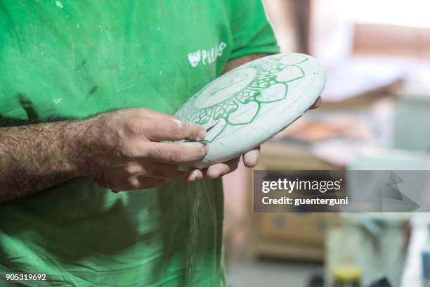 ceramic artist shows a piece of his pottery work, iran - natanz stock pictures, royalty-free photos & images