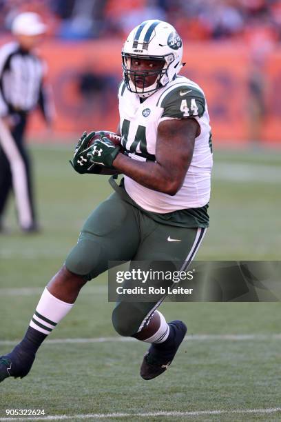 Lawrence Thomas of the New York Jets runs with the ball during the game against the Denver Broncos at Sports Authority Field At Mile High on December...