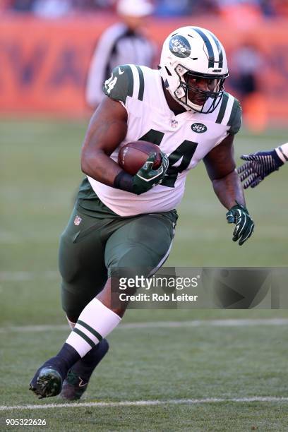 Lawrence Thomas of the New York Jets runs with the ball during the game against the Denver Broncos at Sports Authority Field At Mile High on December...