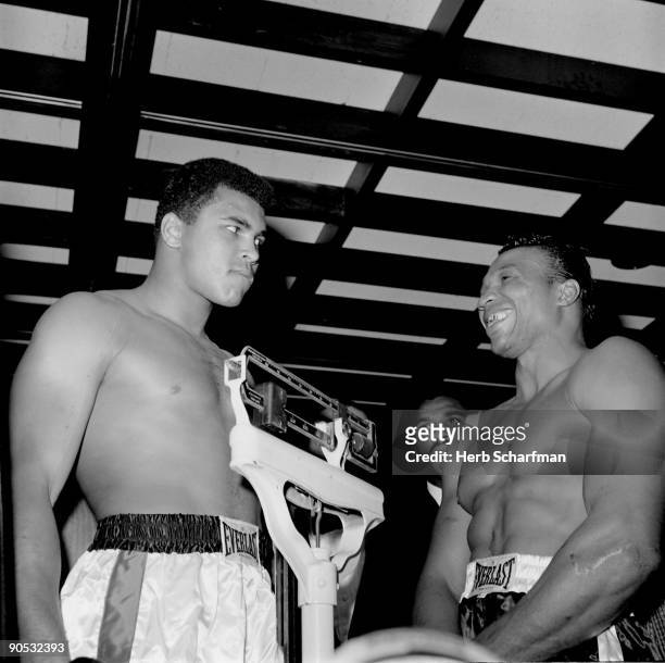 World Heavyweight Title: Muhammad Ali standing on scale next to Cleveland Williams during weigh in before fight at Astrodome. Houston, TX CREDIT:...