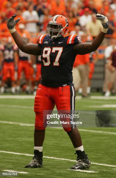 Arthur Jones of the Syracuse Orange pumps up the crowd during the game against the Minnesota Gophers at the Carrier Dome on September 5, 2009 in...