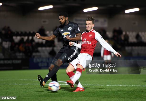 Vlad Dragomir scores Arsenal's 2nd goal under pressure from Ro-Shaun Williams of Man Utd during the Premier League 2 match between Arsenal and...