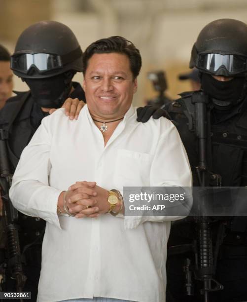 Bolivian priest Jose Mar FLores Pereira, hijacker of an Aeromexico airliner, is taken under arrest in Mexico City September 9, 2009. A Bolivian...