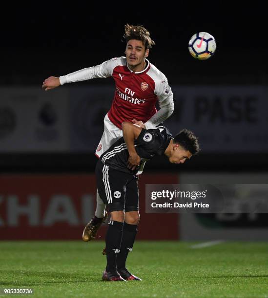 Konstantinos Mavropanos of Arsenal heads the ball under pressure from Nishan Burkart of Man Utd during the Premier League 22 match between Arsenal...