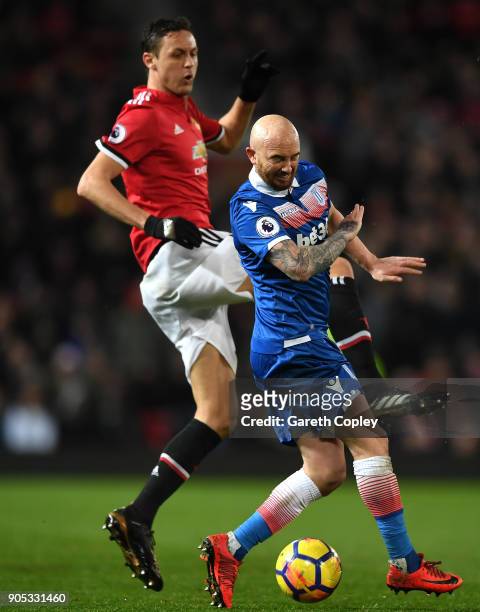 Nemanja Matic of Manchester United and Stephen Ireland of Stoke City battle for the ball during the Premier League match between Manchester United...