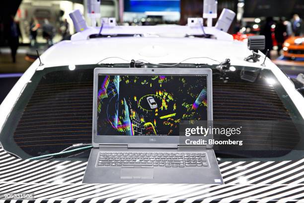 Laptop computer displaying the "vision" system of a Ford Motor Co. Fusion set-up as an experimental self-driving delivery vehicle displayed during...