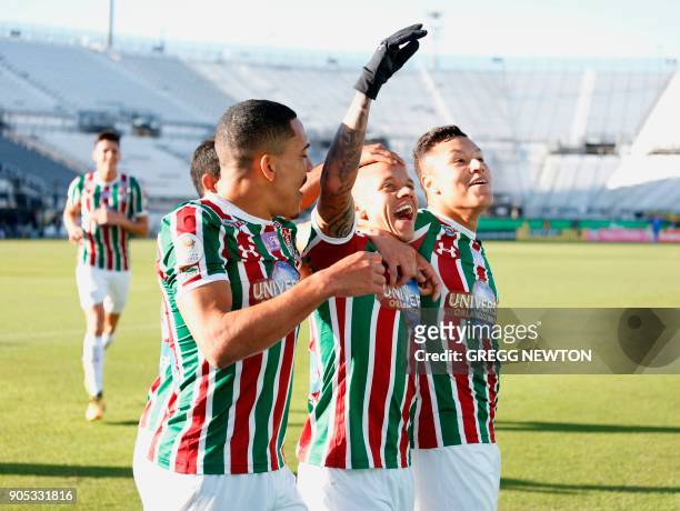 Marcos Junior of Brazilian club Fluminense celebrates with teammates after scoring a goal in the first half against Barcelona SC of Ecuador during...