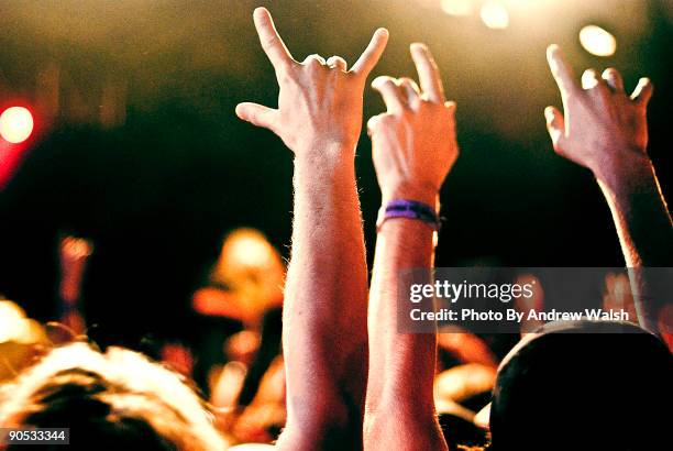 rock concert - concert hands stock pictures, royalty-free photos & images