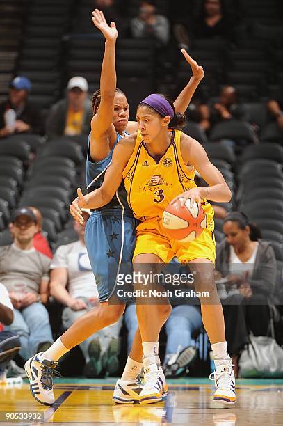 Candace Parker of the Los Angeles Sparks moves the ball against Monique Currie of the Washington Mystics during the game on August 18, 2009 at...