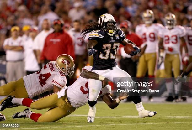 Running back Gartrell Johnson of the San Diego Chargers carries the ball against the San Francisco 49ers on September 4, 2009 at Qualcomm Stadium in...