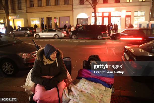 Tim and Felix wait bundled against the cold across the street from the Overkill sneaker store ahead of the release of the very limited edition adidas...