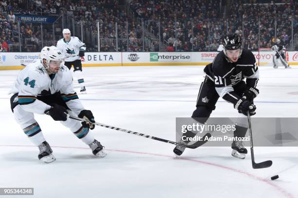 Nick Shore of the Los Angeles Kings controls the puck against Marc-Edouard Vlasic of the San Jose Sharks at STAPLES Center on January 15, 2018 in Los...
