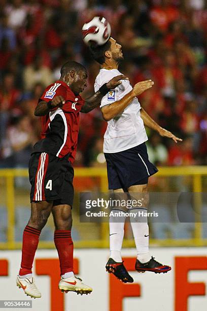 Jlloyd Samuel of Trinidad Tobago fights for the ball with Clinton Dempsey of United States during their FIFA 2010 World Cup North, Central America...