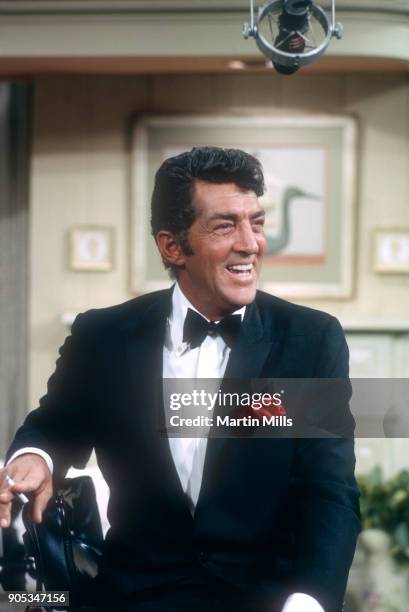 American singer, actor and comedian Dean Martin laughs during the taping of 'The Dean Martin Variety Show' circa 1967 in Los Angeles, California.