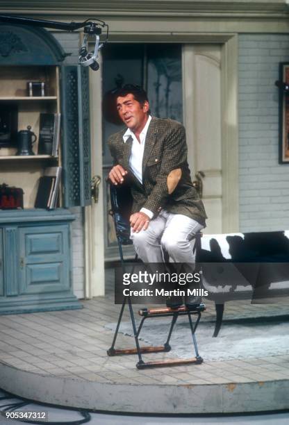 American singer, actor and comedian Dean Martin sings on set during the taping of 'The Dean Martin Variety Show' circa 1967 in Los Angeles,...